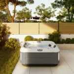 outdoor jacuzzi®️ hot tubs - the J-315 small hot tub on a patio during summer