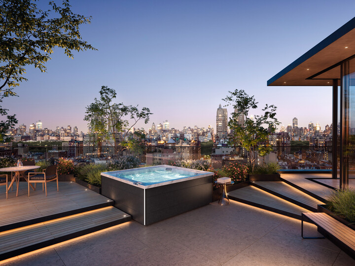 outdoor jacuzzi®️ hot tubs - the J-LXL hot tub with a cityscape in the background